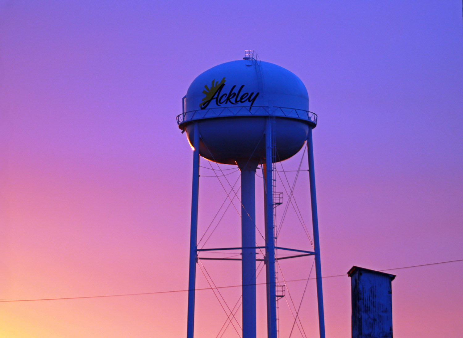 Ackley water tower at sunset