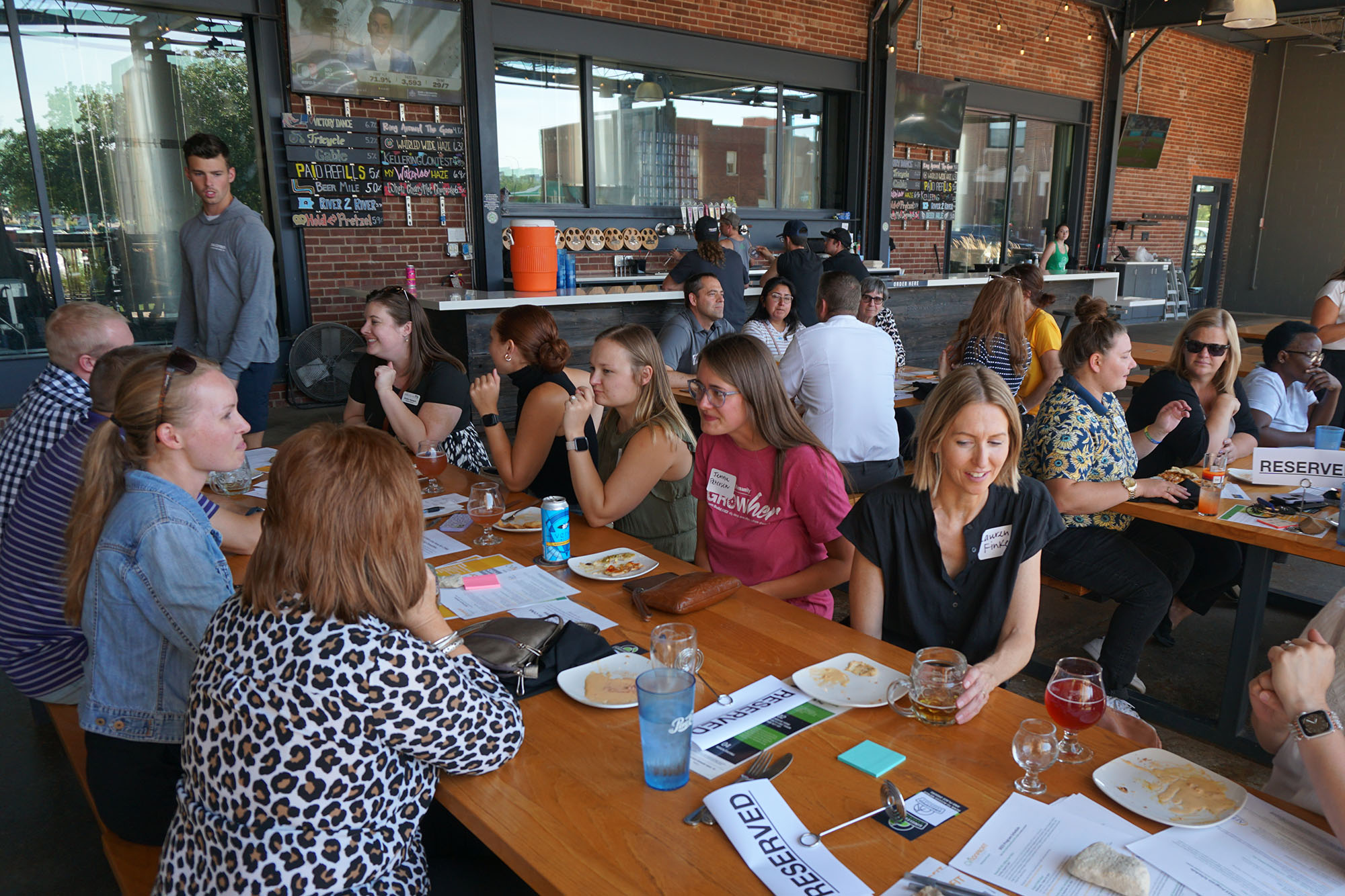 CVNA members sit outside at a social event.